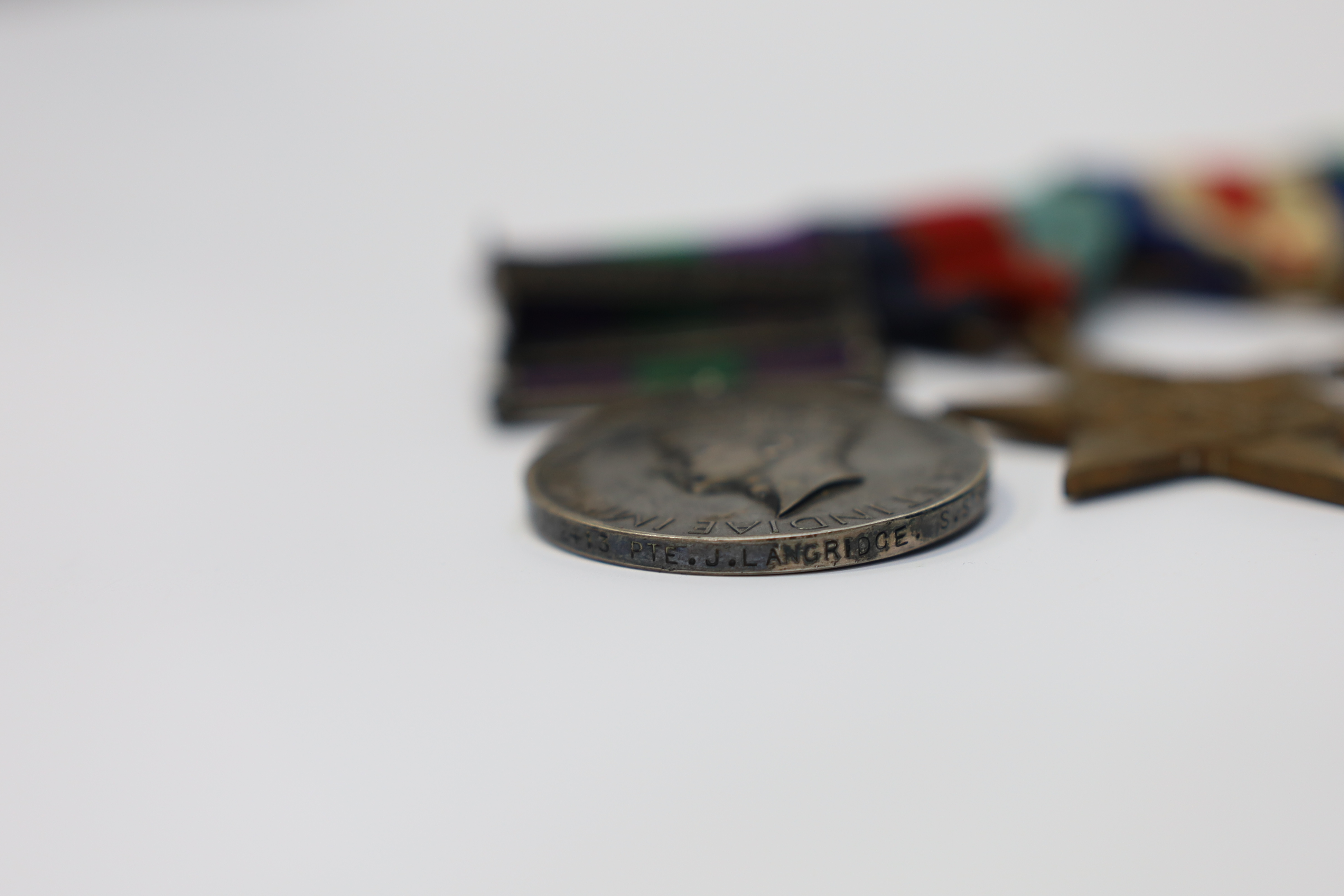 A WWII medal group awarded to Pte. J. Langridge S. Staff, comprising; a General Service Medal with two bars for Palestine and Palestine 1945-48, stamped to the edge with the recipient’s details, together with a 1939-45 S